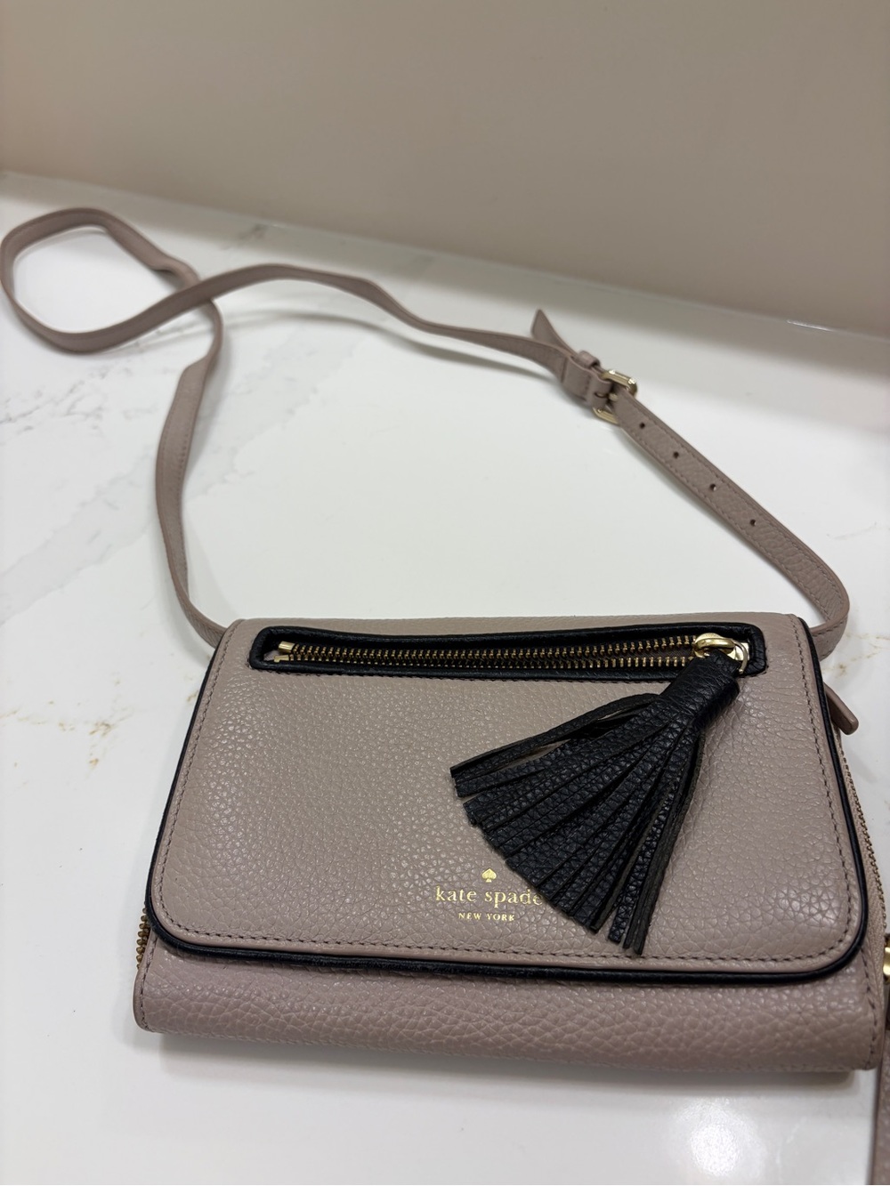 kate spade New York Pebbled Leather Crossbody Bag in Taupe with Black Tassel